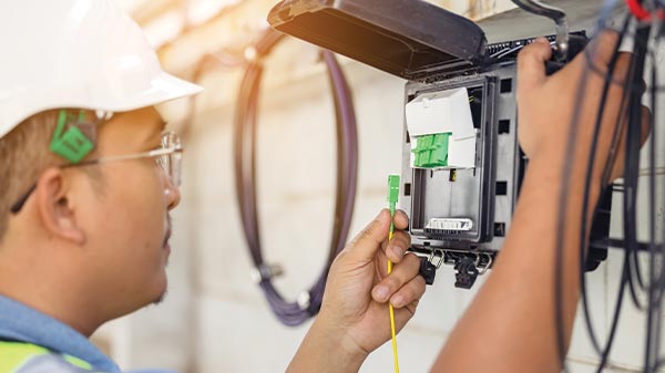 an electrical engineer working on cables